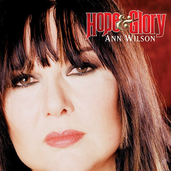 Close-up of Ann Wilson's face with dark hair and makeup, album cover with the title 'Hope & Glory' and the artist's name 'Ann Wilson' in the upper right corner.