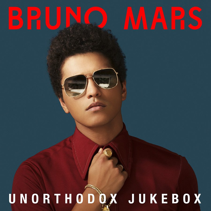 Album cover of Bruno Mars featuring him wearing sunglasses and a red shirt against a blue background with red and white text.
