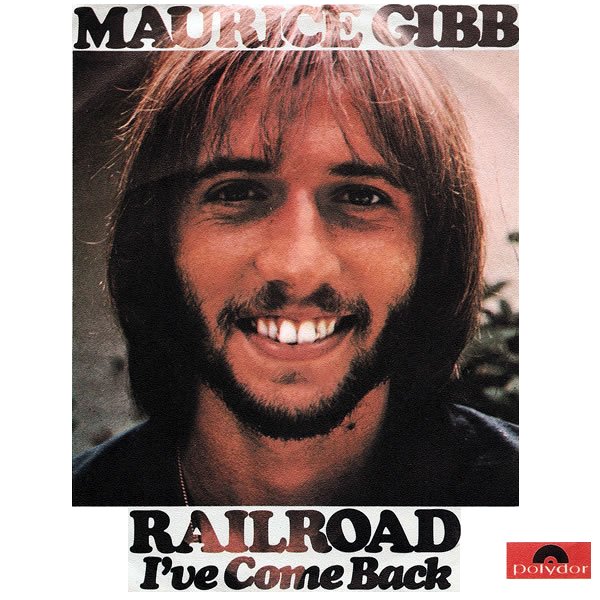 Close-up of Maurice Gibb's smiling face on a vinyl record album cover for 'Railroad I've Come Back' by Maurice Gibb, with the Polydor logo in the bottom right corner.